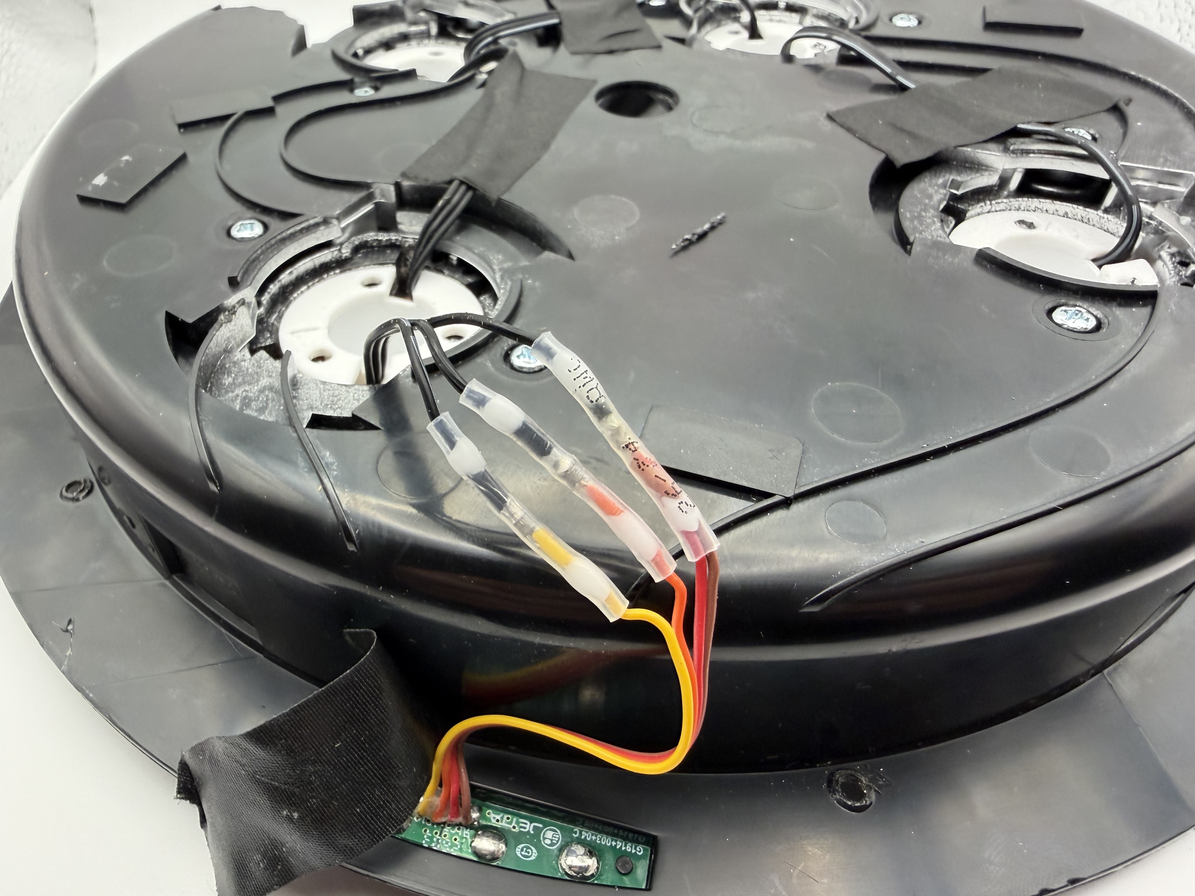 Solder-seal connectors joining the replacement LED wires to the original cyclotron wiring
